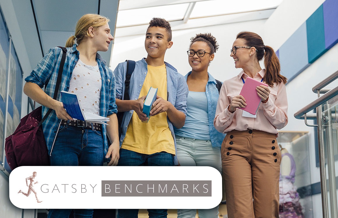 Learners in a school hallway with a teacher, overlaid with the Gatsby Benchmarks logo